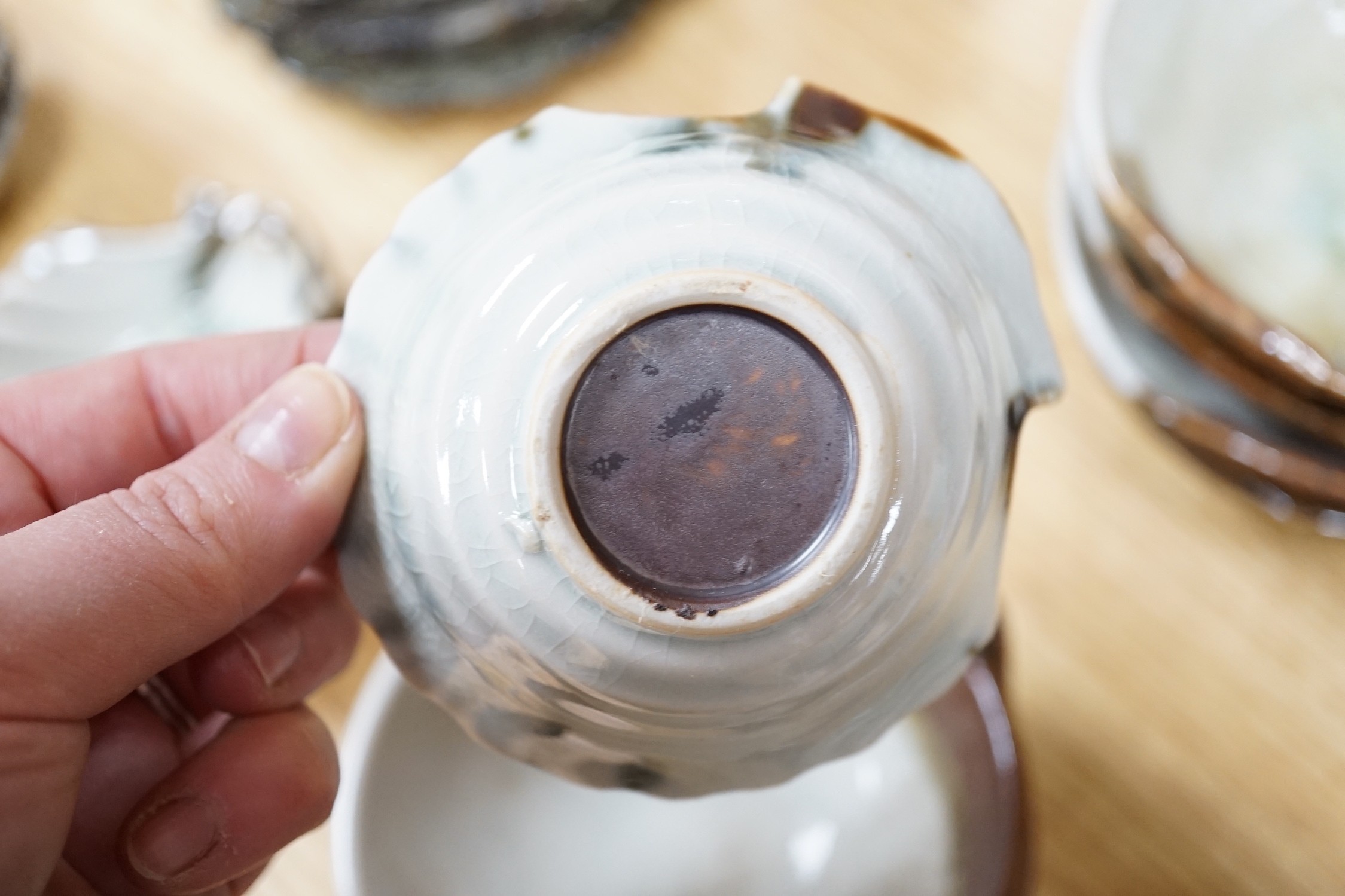 A group of Japanese studio pottery bowls, shell dishes, plates and a teapot, approx 53 pieces